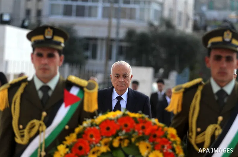 Arab League Secretary-General Nabil Elaraby, lays a wreath at the tomb of late leader Yasser Arafat during during an arrival ceremony in the West Bank city of Ramallah, Dec. 29, 2012. Photo by Issam Rimawi