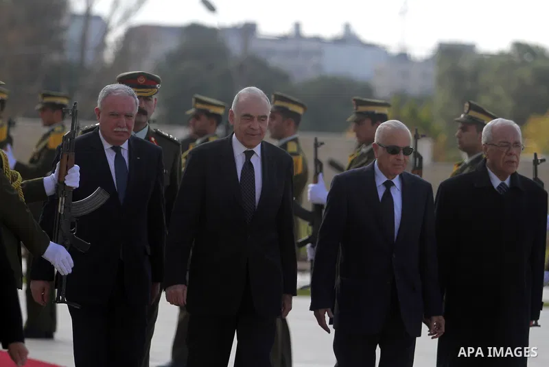 Arab League Secretary-General Nabil Elaraby, and Egyptian foreign Minister Mohamed Kamel Amr, walk past an honor guard during an arrival ceremony in the West Bank city of Ramallah, Dec. 29, 2012. Photo by Issam Rimawi