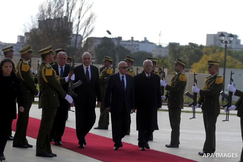 Arab League Secretary-General Nabil Elaraby, and Egyptian foreign Minister Mohamed Kamel Amr, walk past an honor guard during an arrival ceremony in the West Bank city of Ramallah, Dec. 29, 2012. Photo by Issam Rimawi