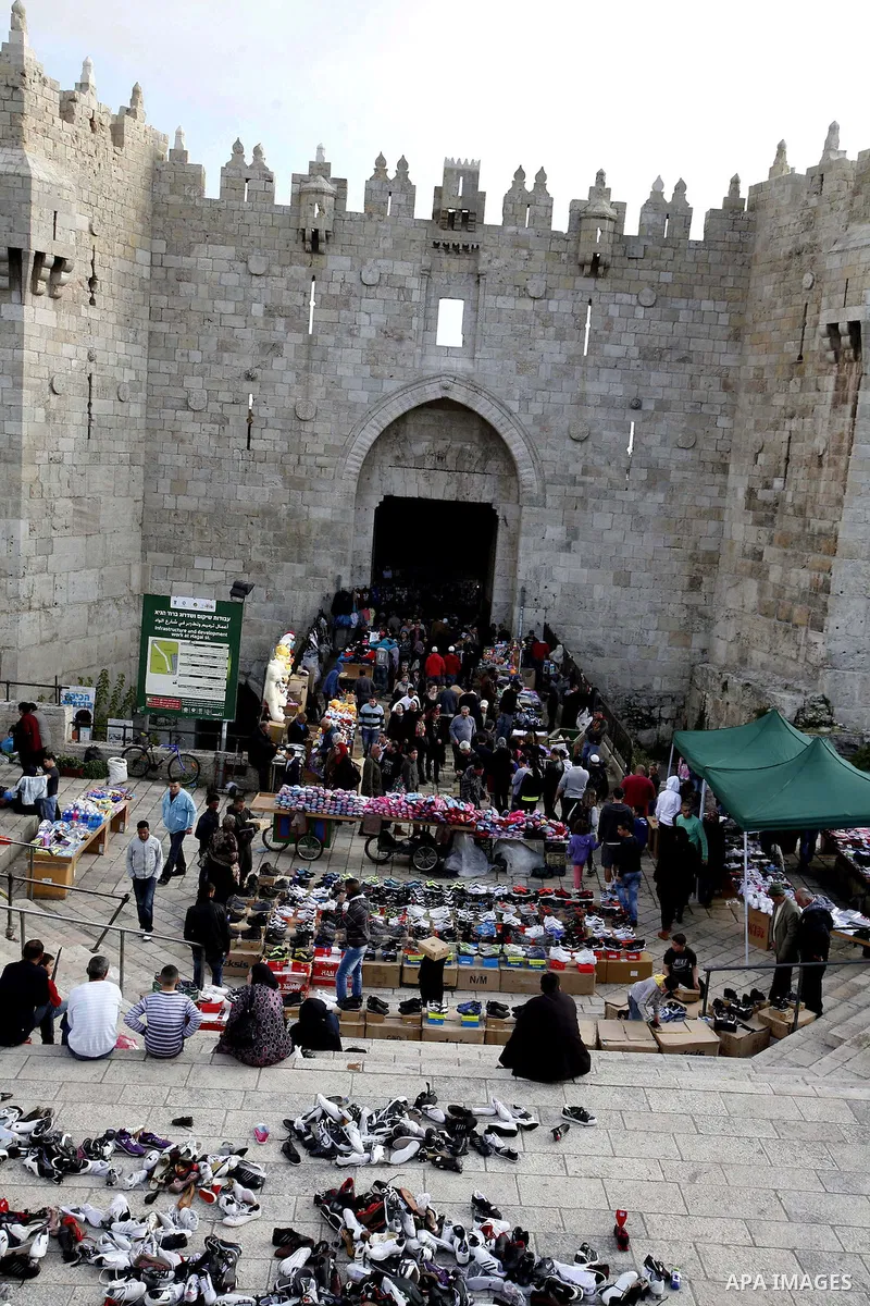Palestinians shop at the market in Jerusalem's old city on December 29, 2012. Photo by Mahfouz Abu Turk