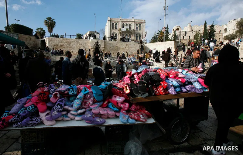 Palestinians shop at the market in Jerusalem's old city on December 29, 2012. Photo by Mahfouz Abu Turk