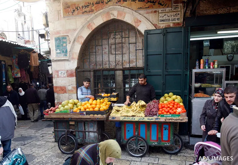 Palestinian vendor sells fruits at the market in Jerusalem's old city on December 29, 2012. . Photo by Mahfouz Abu Turk