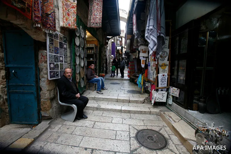 Palestinians shop at the market in Jerusalem's old city on December 29, 2012. Photo by Mahfouz Abu Turk