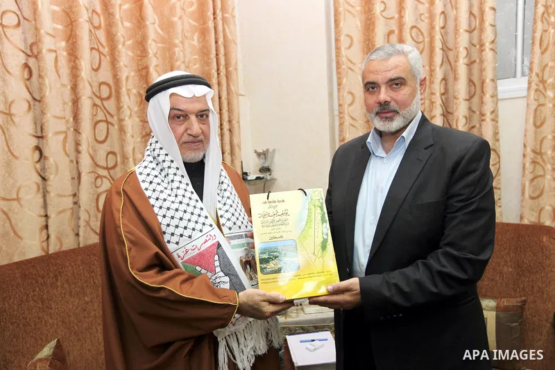 Palestinian Prime Minister Ismail Haniyeh in Gaza strip, meets with former Minister of Awqaf and preacher of Al-Aqsa Mosque, Sheikh Yusuf Salameh in Gaza city on December 29, 2012. Photo by Mohammed Al-Ostaz
