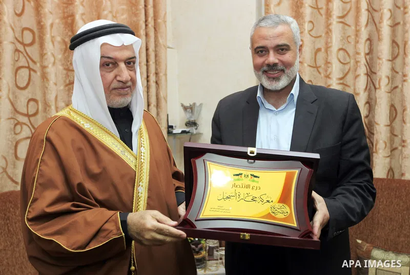 Palestinian Prime Minister Ismail Haniyeh in Gaza strip, meets with former Minister of Awqaf and preacher of Al-Aqsa Mosque, Sheikh Yusuf Salameh in Gaza city on December 29, 2012. Photo by Mohammed Al-Ostaz