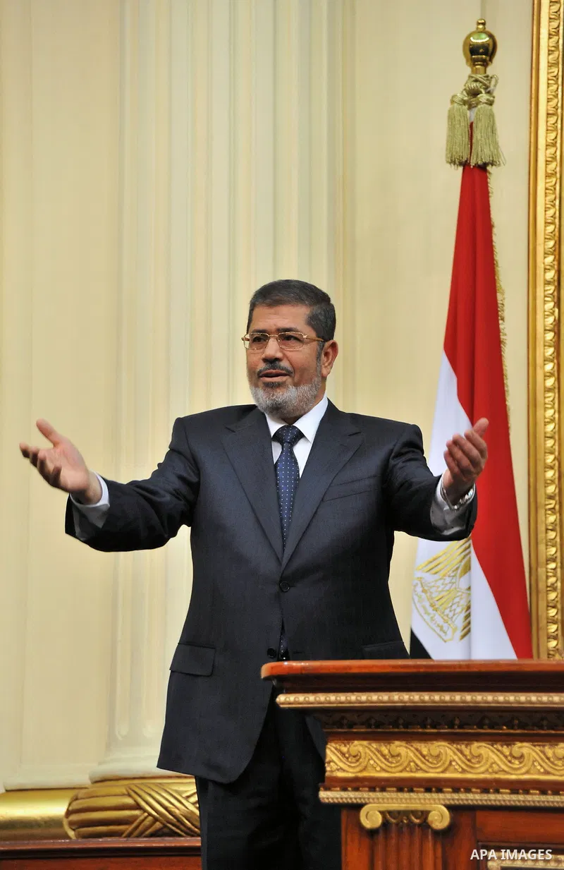 Egyptian President Mohamed Mursi delivers a speech to the Shura Council, or upper house of parliament, in Cairo December 29, 2012. Mursi said on Saturday his country supported the Syrian revolution and that President Bas...