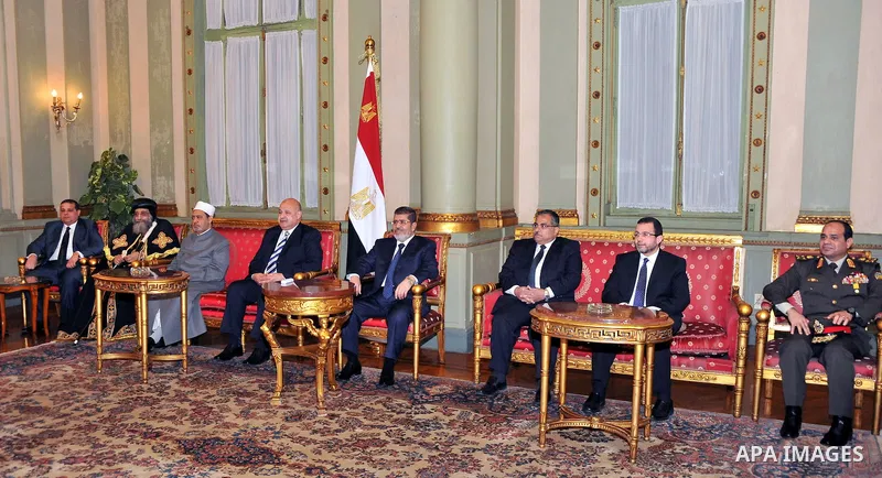 Egyptian President Mohamed Mursi delivers a speech to the Shura Council, or upper house of parliament, in Cairo December 29, 2012. Mursi said on Saturday his country supported the Syrian revolution and that President Bas...