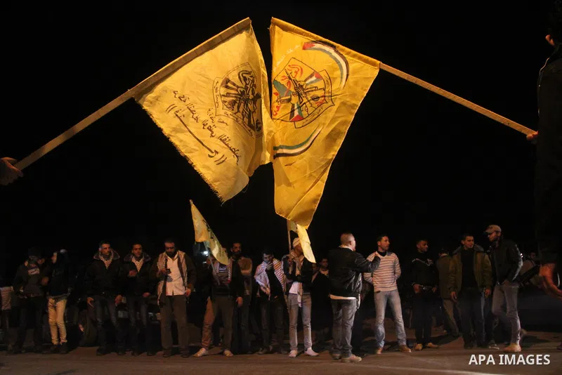 Palestinian supporters of Fatah movement hold the party's flags during a rally in Gaza city on December 30, 2012. The Gaza branch of Palestinian president Mahmud Abbas's Fatah party said on Friday it will mark its annive...