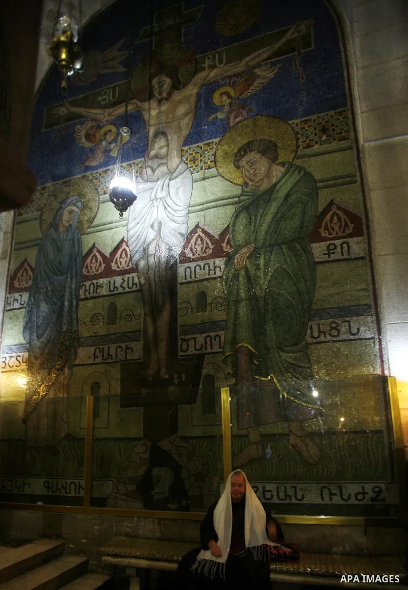 A Palestinian worshipper prays at the church of the Holy Sepulchre in Jerusalem's old city on December 30, 2012. The church has been a paramount - and for many Christians the most important - pilgrimage destination since...