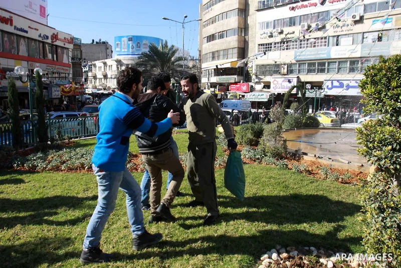 Palestinians stop Jomaa Abu Olifa, 47 years as he pours gasoline trying to set himself on fire during a demonstration against the economic situation and against Palestinian Prime Minister Salam Fayyad in the northern Wes...