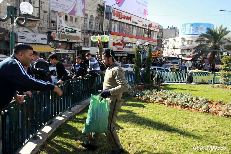 Jomaa Abu Olifa, 47 years, a Palestinian man pours gasoline trying to set himself on fire during a demonstration against the economic situation and against Palestinian Prime Minister Salam Fayyad in the northern West Ban...