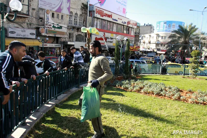 Jomaa Abu Olifa, 47 years, a Palestinian man pours gasoline trying to set himself on fire during a demonstration against the economic situation and against Palestinian Prime Minister Salam Fayyad in the northern West Ban...