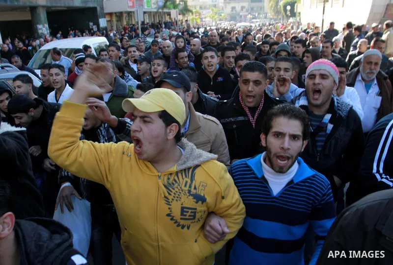Palestinians shout slogans during a demonstration against the economic situation and against Palestinian prime minister Salam Fayyad in the northern West Bank city of Nablus on December 31, 2012. The protest came after F...