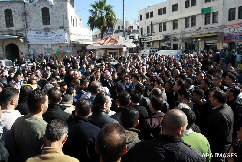 Palestinians shout slogans during a demonstration against the economic situation and against Palestinian prime minister Salam Fayyad in the northern West Bank city of Nablus on December 31, 2012. The protest came after F...