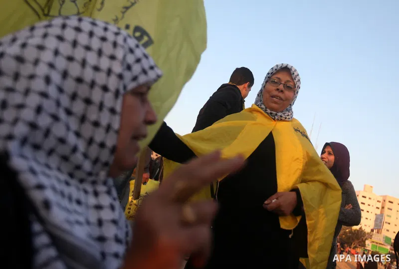 A Palestinian woman marks victory sign during a rally in Gaza city on December 31, 2012. The Gaza branch of Palestinian president Mahmud Abbas's Fatah party said on Friday it will mark its anniversary in the Hamas-ruled...