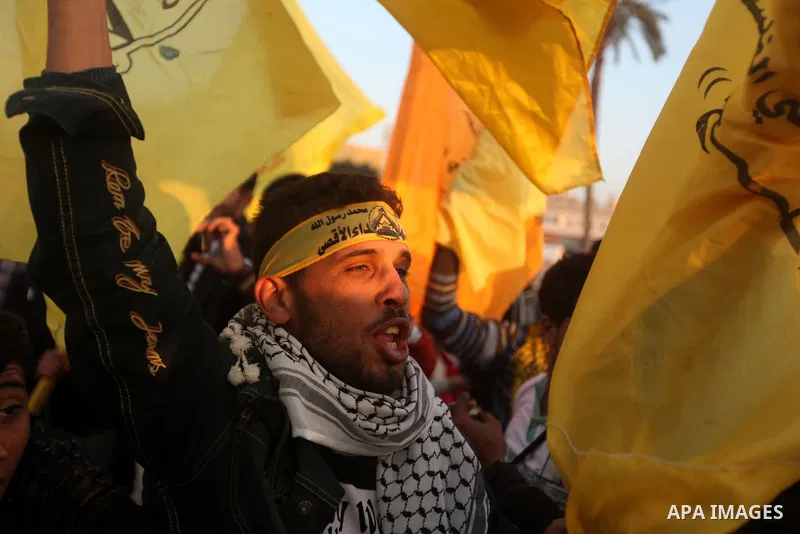Palestinian supporters of Fatah movement hold the party's flags during a rally in Gaza city on December 31, 2012. The Gaza branch of Palestinian president Mahmud Abbas's Fatah party said on Friday it will mark its annive...