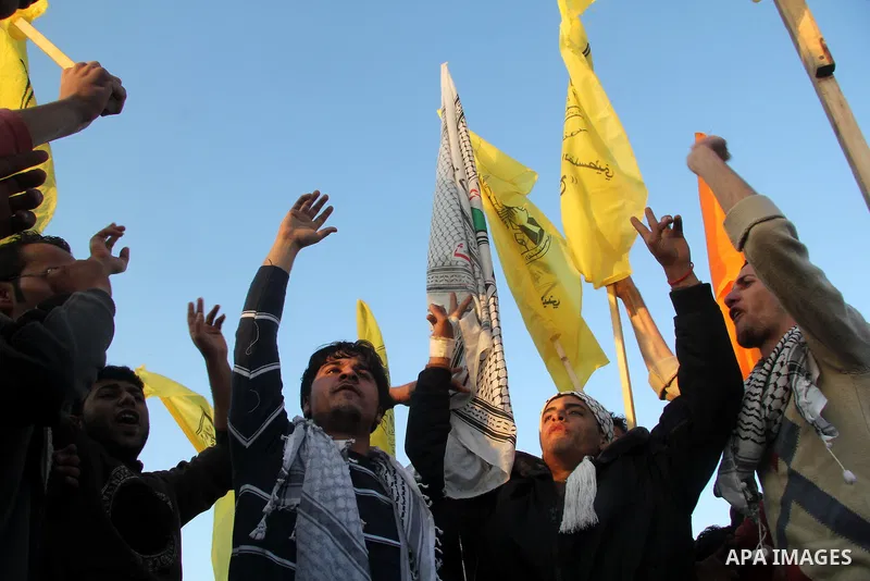 Palestinian supporters of Fatah movement hold the party's flags during a rally in Gaza city on December 31, 2012. The Gaza branch of Palestinian president Mahmud Abbas's Fatah party said on Friday it will mark its annive...