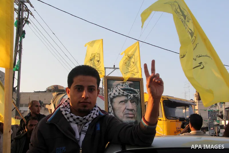 Palestinian supporters of Fatah movement hold the party's flags during a rally in Gaza city on December 31, 2012. The Gaza branch of Palestinian president Mahmud Abbas's Fatah party said on Friday it will mark its annive...