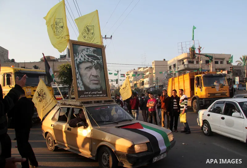 Palestinian supporters of Fatah movement hold the party's flags during a rally in Gaza city on December 31, 2012. The Gaza branch of Palestinian president Mahmud Abbas's Fatah party said on Friday it will mark its annive...