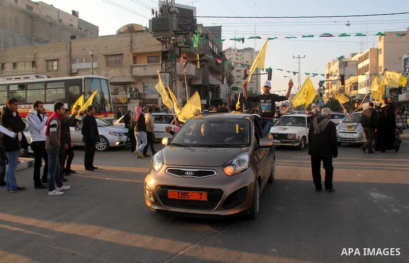 Palestinian supporters of Fatah movement hold the party's flags during a rally in Gaza city on December 31, 2012. The Gaza branch of Palestinian president Mahmud Abbas's Fatah party said on Friday it will mark its annive...