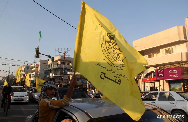 Palestinian supporters of Fatah movement hold the party's flags during a rally in Gaza city on December 31, 2012. The Gaza branch of Palestinian president Mahmud Abbas's Fatah party said on Friday it will mark its annive...