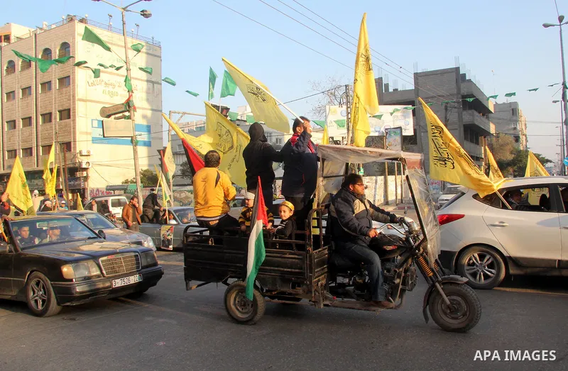 Palestinian supporters of Fatah movement hold the party's flags during a rally in Gaza city on December 31, 2012. The Gaza branch of Palestinian president Mahmud Abbas's Fatah party said on Friday it will mark its annive...