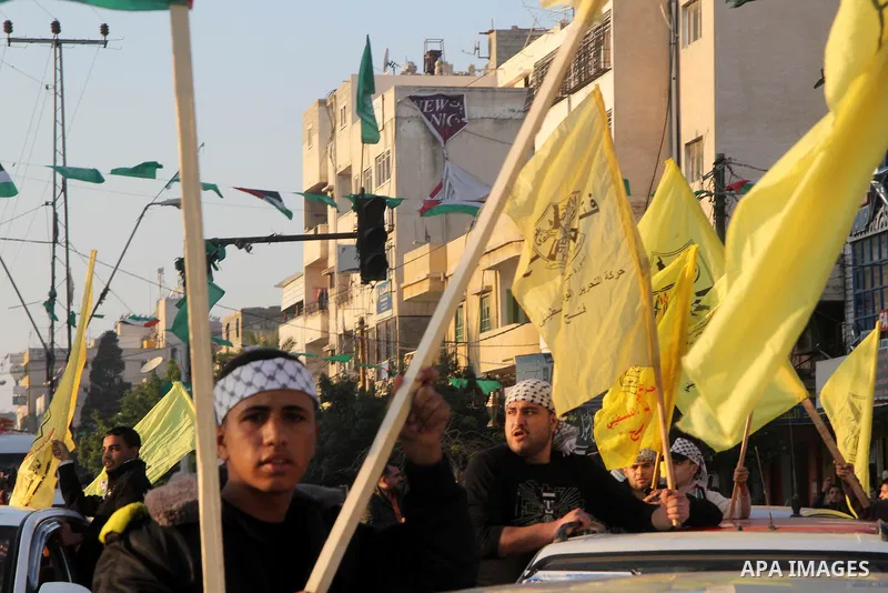 Palestinian supporters of Fatah movement hold the party's flags during a rally in Gaza city on December 31, 2012. The Gaza branch of Palestinian president Mahmud Abbas's Fatah party said on Friday it will mark its annive...