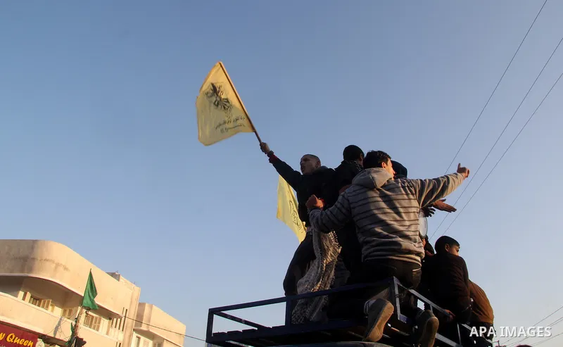 Palestinian supporters of Fatah movement hold the party's flags during a rally in Gaza city on December 31, 2012. The Gaza branch of Palestinian president Mahmud Abbas's Fatah party said on Friday it will mark its annive...