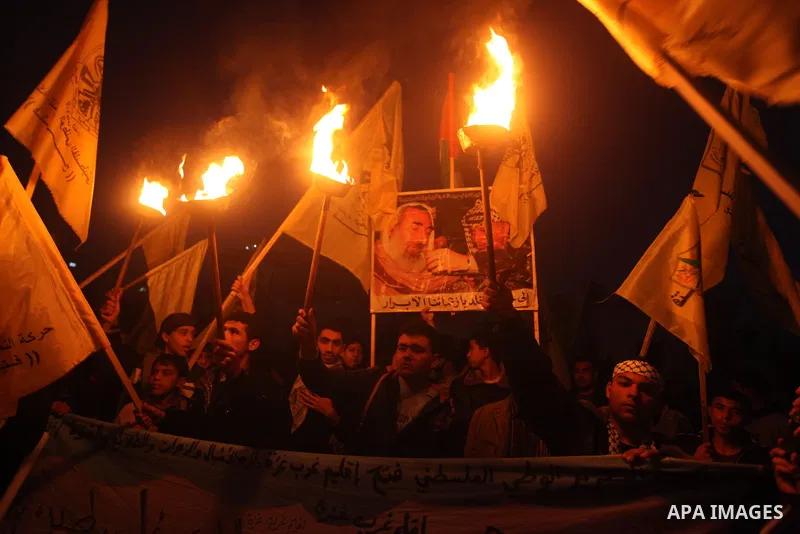 Palestinian supporters of Fatah movement hold the party's flags during a rally in Gaza city on December 31, 2012. The Gaza branch of Palestinian president Mahmud Abbas's Fatah party said on Friday it will mark its annive...