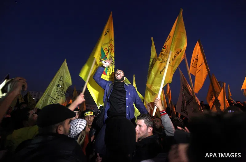 Palestinian supporters of Fatah movement hold the party's flags during a rally in Gaza city on December 31, 2012. The Gaza branch of Palestinian president Mahmud Abbas's Fatah party said on Friday it will mark its annive...