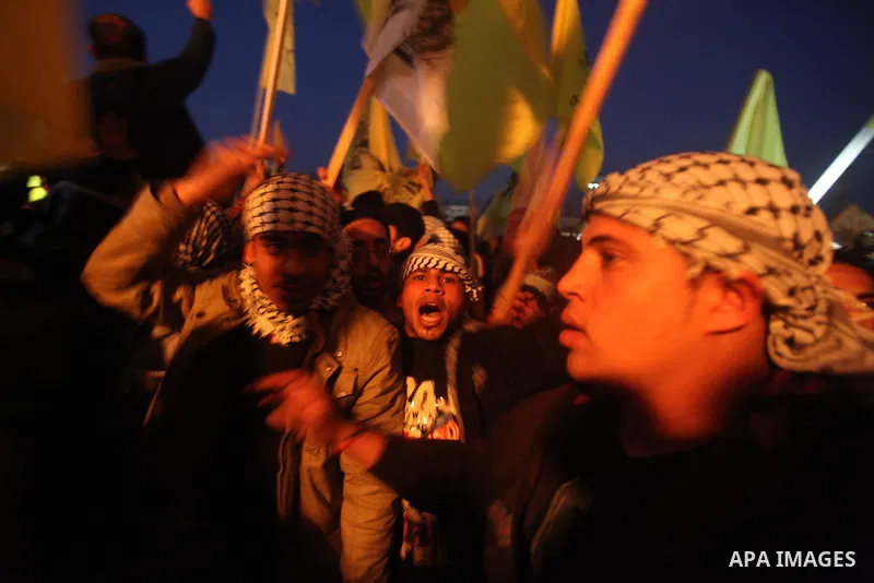 Palestinian supporters of Fatah movement hold the party's flags during a rally in Gaza city on December 31, 2012. The Gaza branch of Palestinian president Mahmud Abbas's Fatah party said on Friday it will mark its annive...