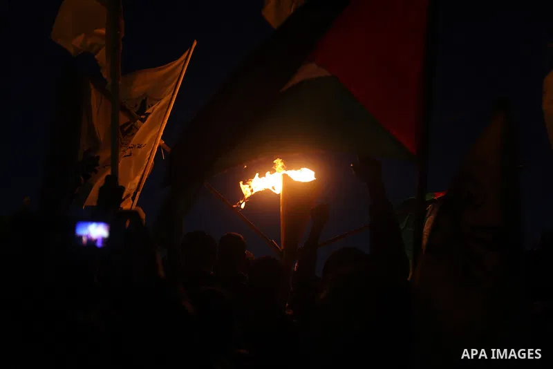 Palestinian supporters of Fatah movement hold the party's torch during a rally in Gaza city on December 31, 2012. The Gaza branch of Palestinian president Mahmud Abbas's Fatah party said on Friday it will mark its annive...