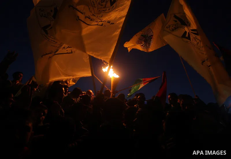 Palestinian supporters of Fatah movement hold the party's torch during a rally in Gaza city on December 31, 2012. The Gaza branch of Palestinian president Mahmud Abbas's Fatah party said on Friday it will mark its annive...