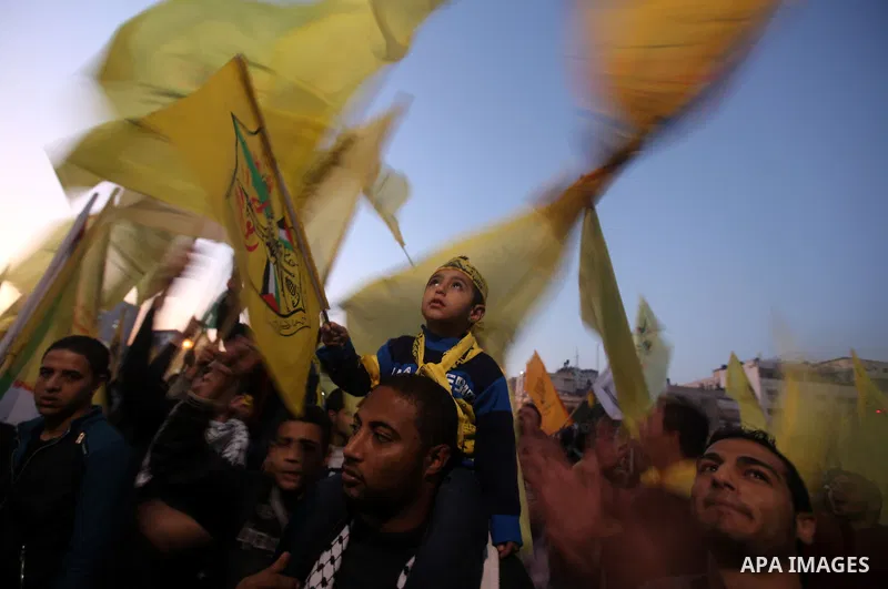 Palestinian supporters of Fatah movement hold the party's flags during a rally in Gaza city on December 31, 2012. The Gaza branch of Palestinian president Mahmud Abbas's Fatah party said on Friday it will mark its annive...