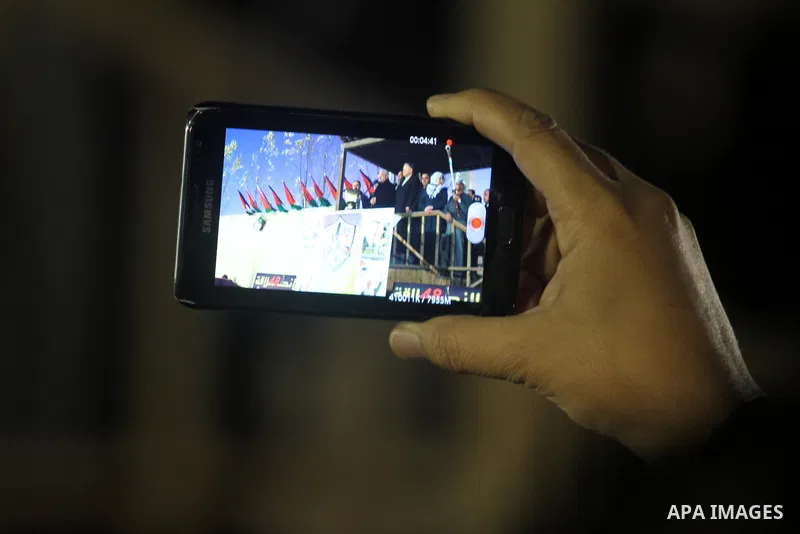 Palestinian President Mahmud Abbas speaks as thousands of Palestinians look on, on the eve of the 48th anniversary of the formation on the Fatah movement, on December 31, 2012, in the West Bank city of Ramallah. The Fata...