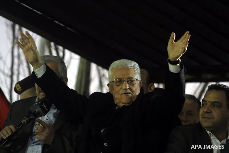 Palestinian President Mahmud Abbas gestures as thousands of Palestinians look on, on the eve of the 48th anniversary of the formation on the Fatah movement, on December 31, 2012, in the West Bank city of Ramallah. The Fa...
