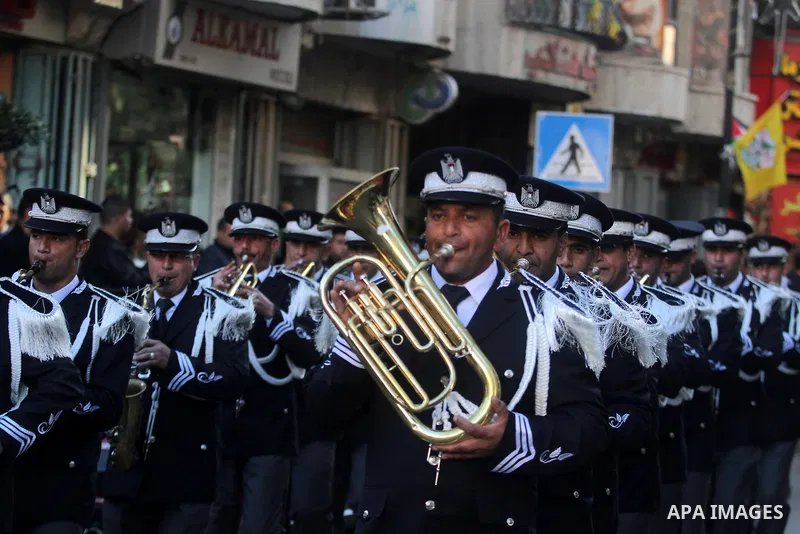 Palestinian military band march during a rally on the eve of the 48th anniversary of the formation on the Fatah movement, on December 31, 2012, in the West Bank city of Ramallah. The Fatah anniversary commemorates the fi...