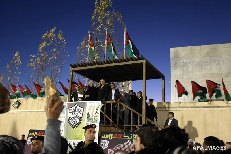 Palestinian President Mahmud Abbas speaks as thousands of Palestinians look on, on the eve of the 48th anniversary of the formation on the Fatah movement, on December 31, 2012, in the West Bank city of Ramallah. The Fata...