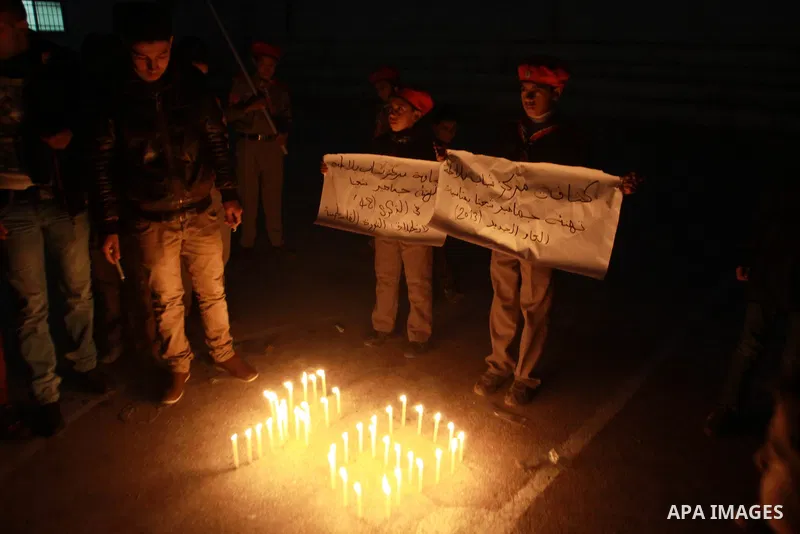 Palestinian supporters of Fatah movement place candles during a rally on the eve of the 48th anniversary of the formation on the Fatah movement, on December 31, 2012, in the West Bank city of Nablus. The Fatah anniversar...