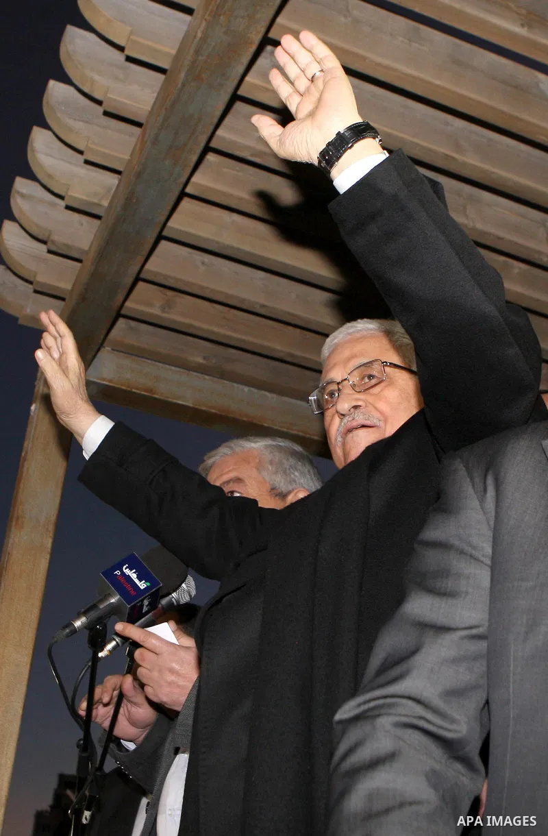 Palestinian President Mahmud Abbas speaks as thousands of Palestinians look on, on the eve of the 48th anniversary of the formation on the Fatah movement, on December 31, 2012, in the West Bank city of Ramallah. The Fata...
