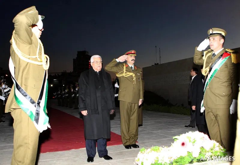 Palestinian president lays a floral wreath on the former Palestinian leader grave Yasser Arafat, on the eve of the 48th anniversary of the formation on the Fatah movement, on December 31, 2012, in the West Bank city of R...