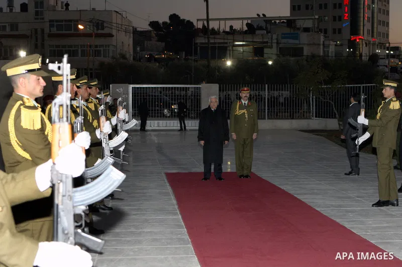 Palestinian president lays a floral wreath on the former Palestinian leader grave Yasser Arafat, on the eve of the 48th anniversary of the formation on the Fatah movement, on December 31, 2012, in the West Bank city of R...