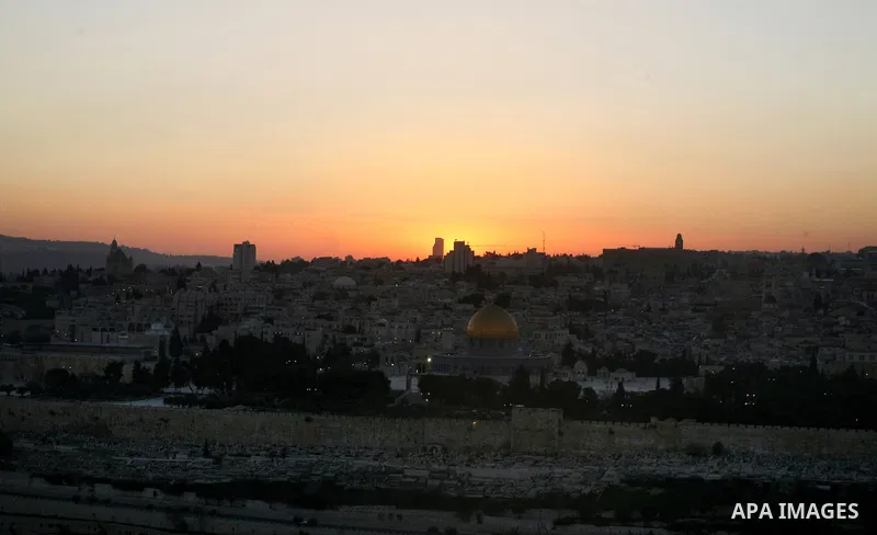 A general photo shows the Dome of the Rock mosque during the sunset on the last day of the year on December 31, 2012. Photo by Mahfouz Abu Turk