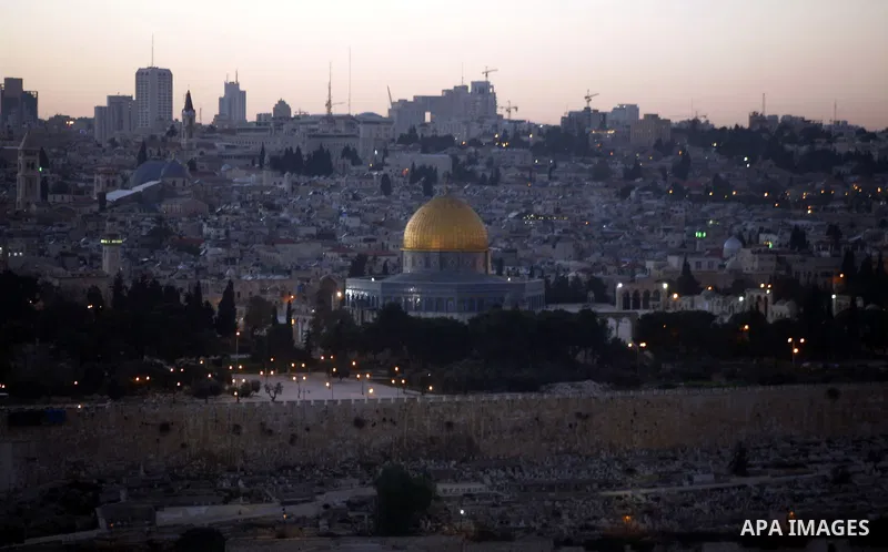 A general photo shows the Dome of the Rock mosque during the sunset on the last day of the year on December 31, 2012. Photo by Mahfouz Abu Turk