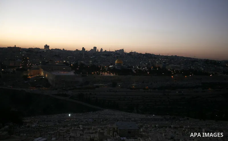A general photo shows the Dome of the Rock mosque during the sunset on the last day of the year on December 31, 2012. Photo by Mahfouz Abu Turk