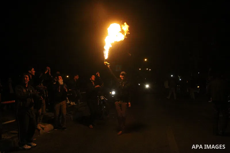Palestinians hold torches as they celebrate the 48th anniversary of the founding of Fatah movement in Gaza City December 31, 2012. Photo by Ezz al-Zanoon