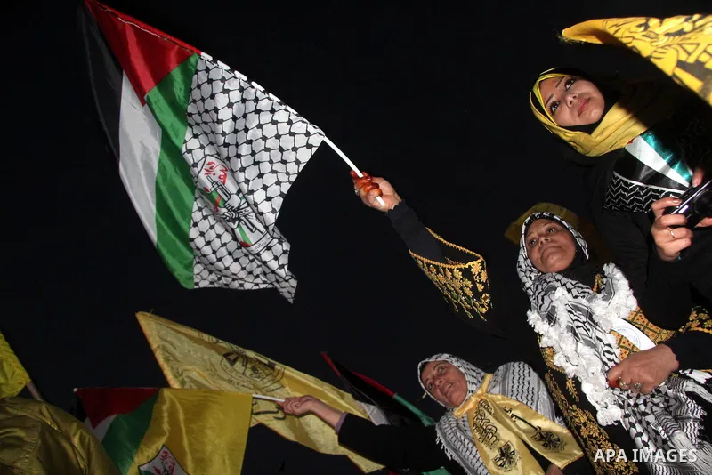 Supporters of Fatah movement attend the 48th anniversary of the Gaza branch of the party in Gaza city, on January 3, 2012. The anniversary commemorates the first operation against Israel claimed by its armed wing then kn...