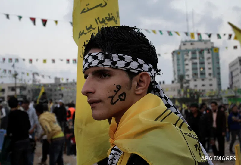 Palestinians take part in a rally marking the 48th anniversary of the founding of the Fatah movement, in Gaza City January 4, 2013. Hundreds of thousands of Palestinians joined a rare rally staged by President Mahmoud Ab...