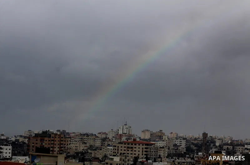 A rainbow is seen over Gaza city on a windy winter day on January 10, 2013. Photo by Ashraf Amra