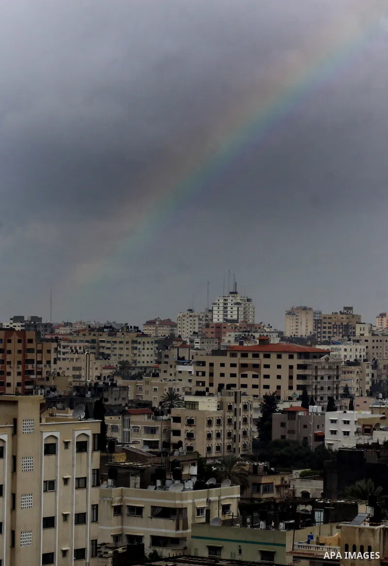 A rainbow is seen over Gaza city on a windy winter day on January 10, 2013. Photo by Ashraf Amra